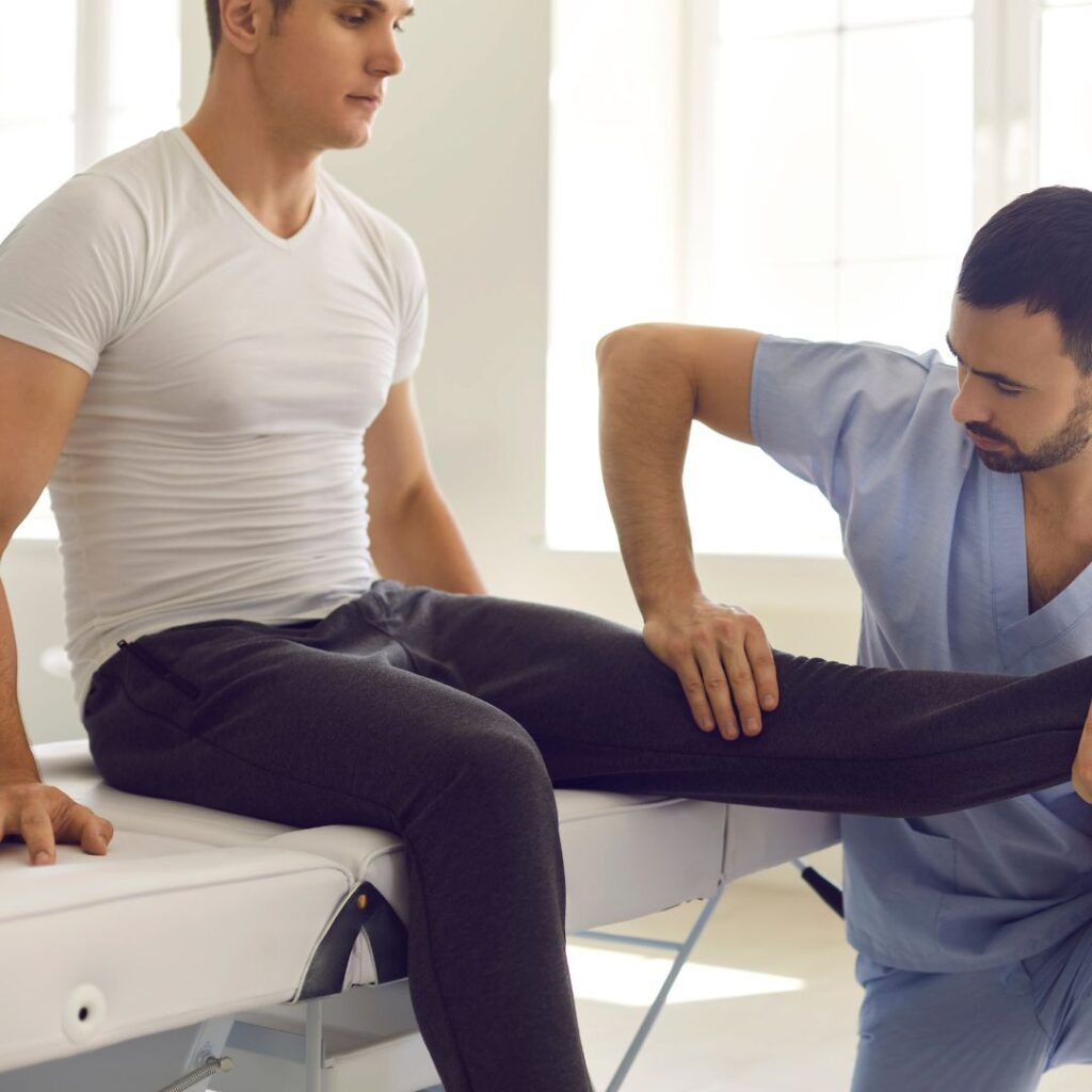AOI-Signs You Need to See a Knee Replacement Specialist 2 A person stretching their knee