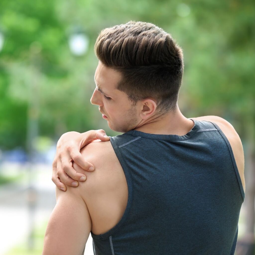 AOI-The Importance of Early Diagnosis in Shoulder Care 2 Person grabbing their shoulder in pain