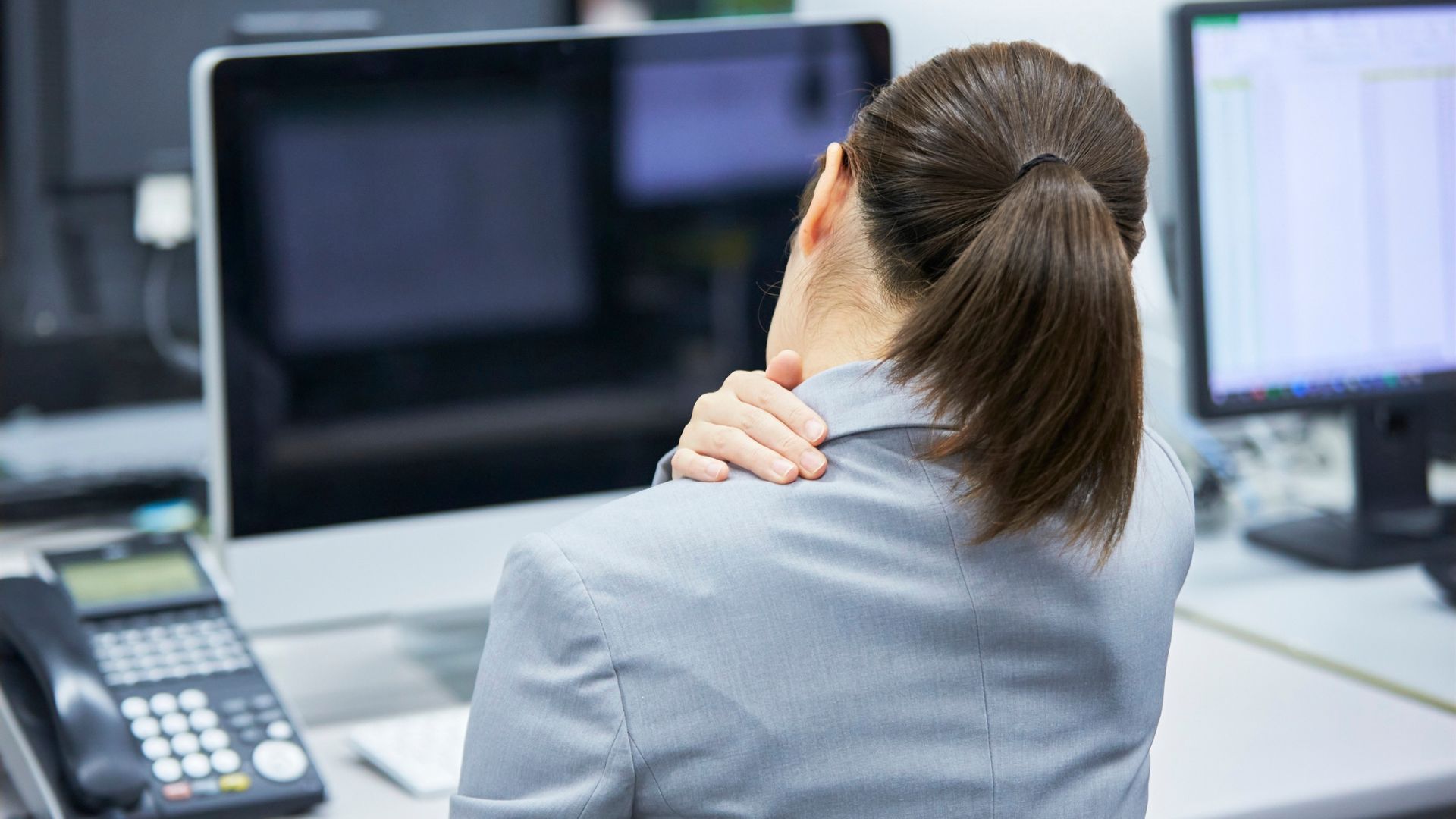 Person suffering neck pain